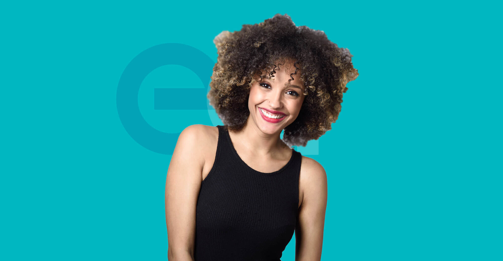 Woman in black vest top smiling with EA logo